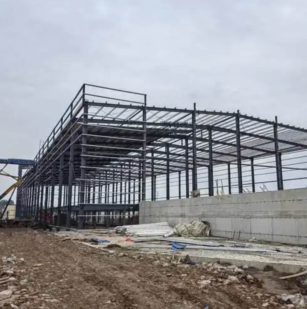 a64eeff6-bba8-4e1c-a98a-ff999daf7565_Xiaolong prefabricated steel frame building under construction, industrial factory steel structure project site.jpg